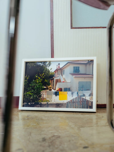 Stanze private fotografie lifestyle framed print showing Mediterranean domestic scene with laundry